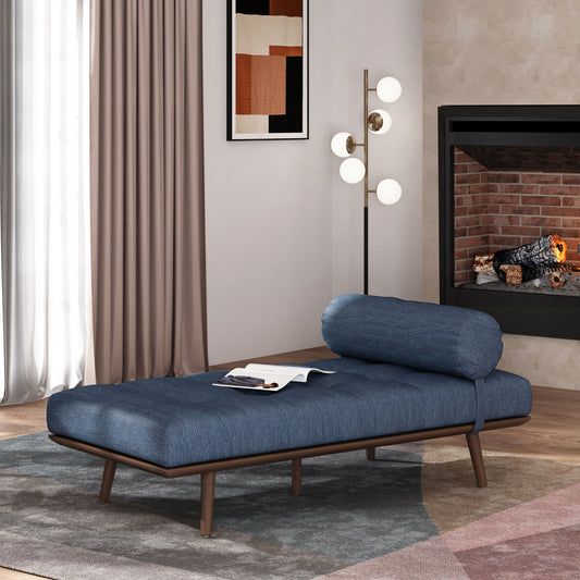 Tufted denim blue chaise lounge with bolter pillow on dark wood legs