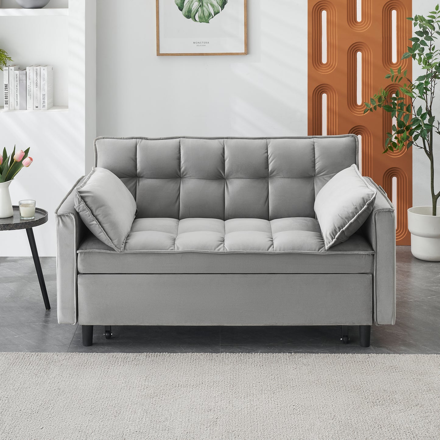 Grey tufted velvet sofa with two matching throw pillows perfect for small spaces