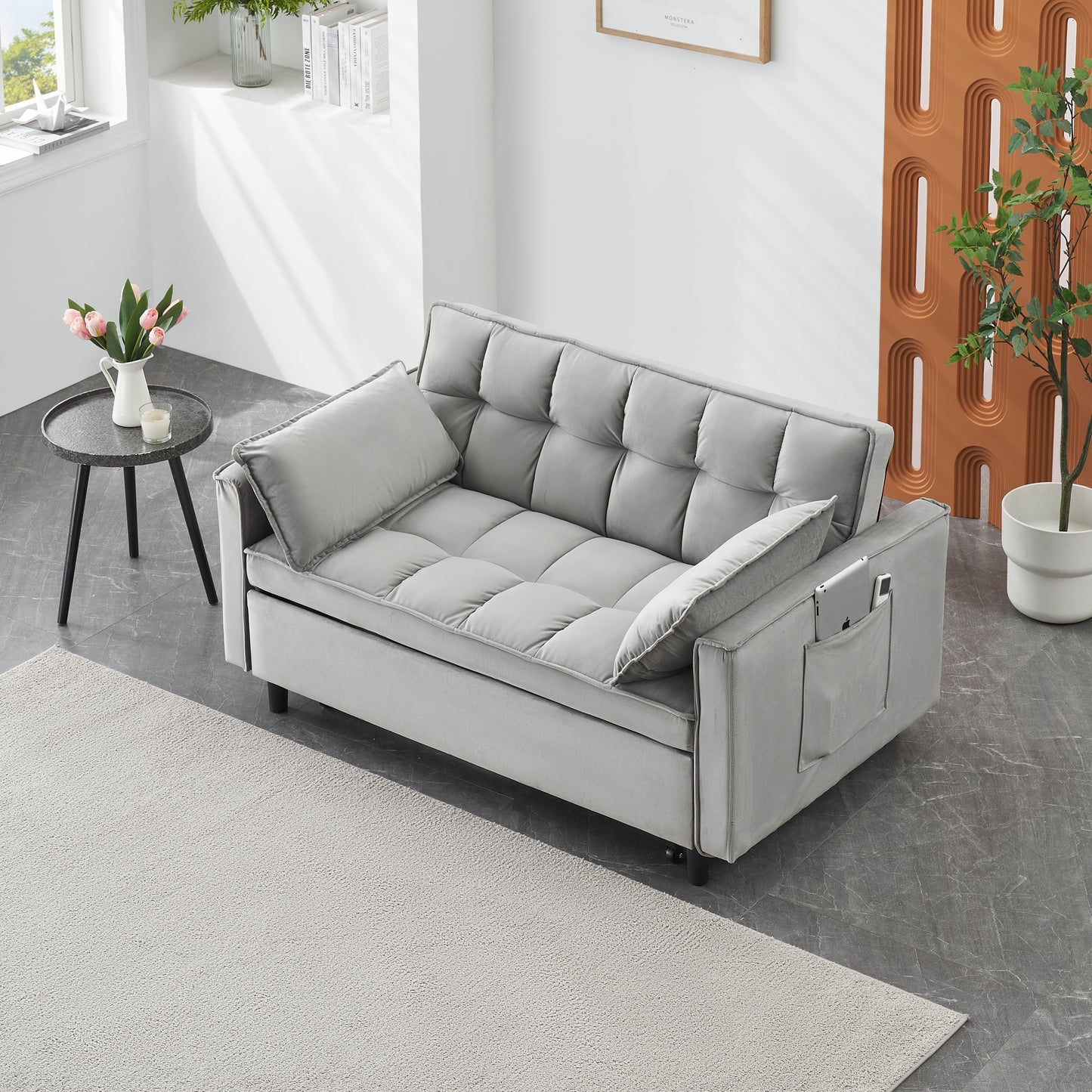 Tufted grey velvet sofa with modern design ideal for small living spaces