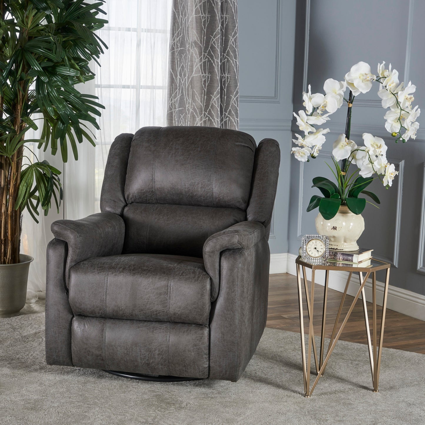 Comfortable dark gray leather recliner chair with plush cushioning for ultimate relaxation