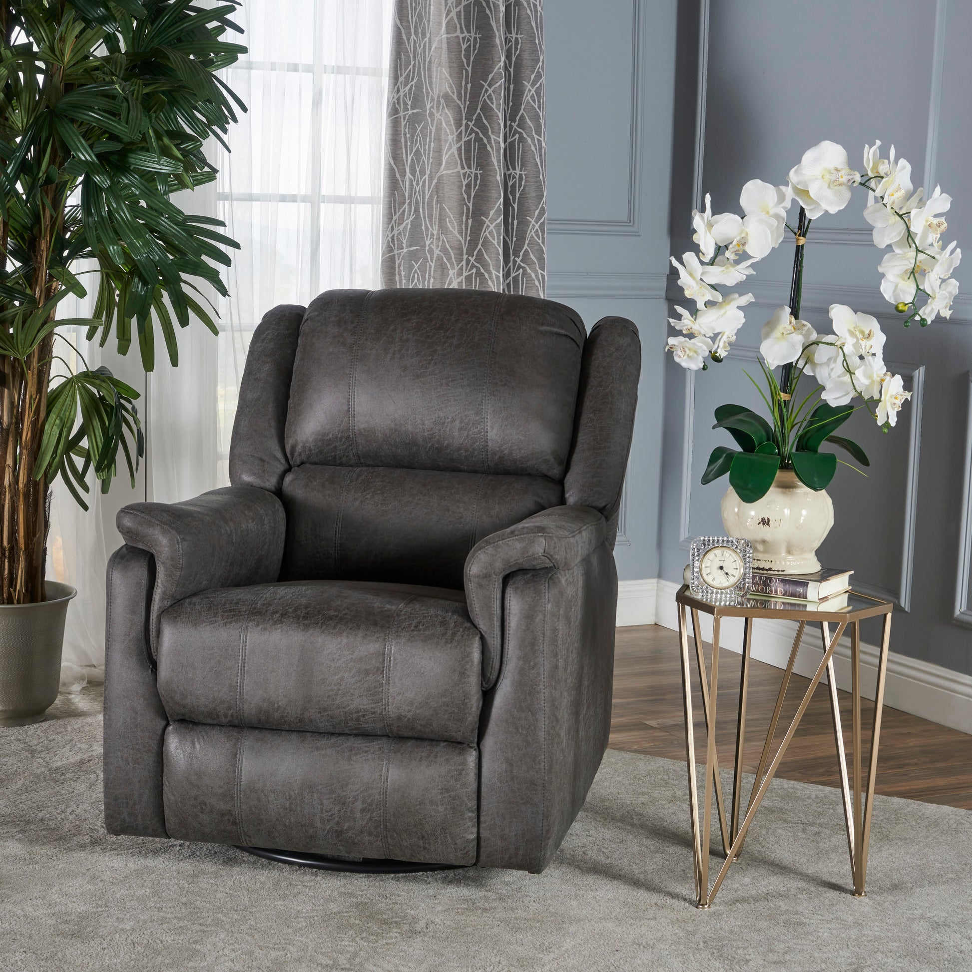 Comfortable dark gray leather recliner chair with plush cushioning for ultimate relaxation