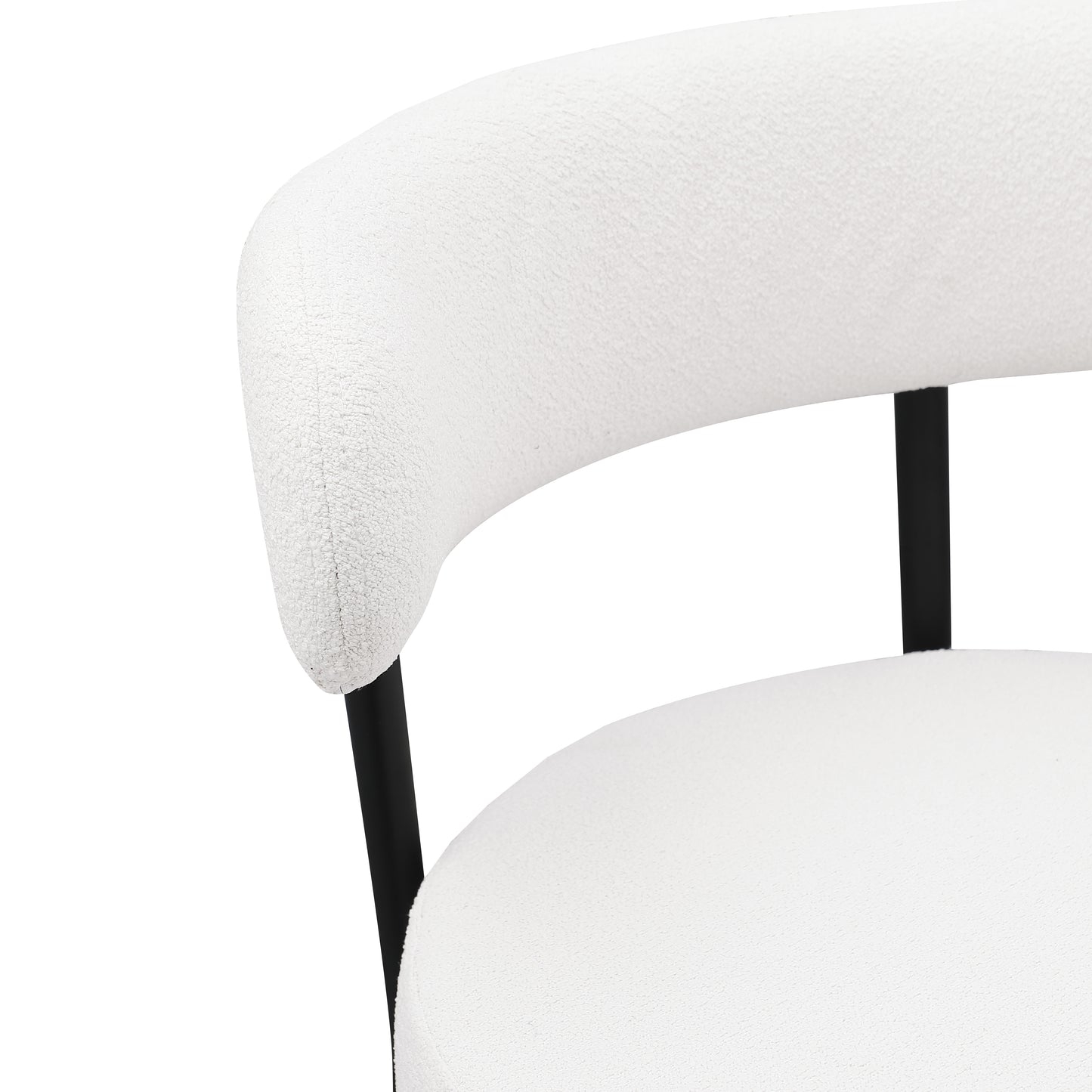 White boucle accent chair with curved back and black metal legs