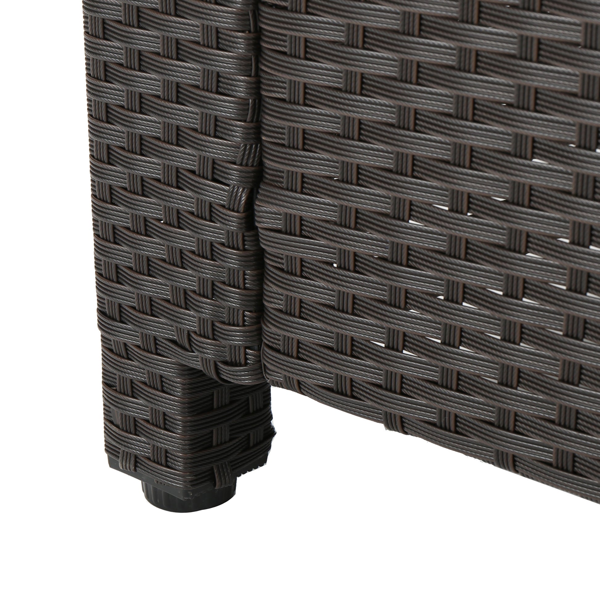 Dark brown wicker rattan texture detail of outdoor furniture leg