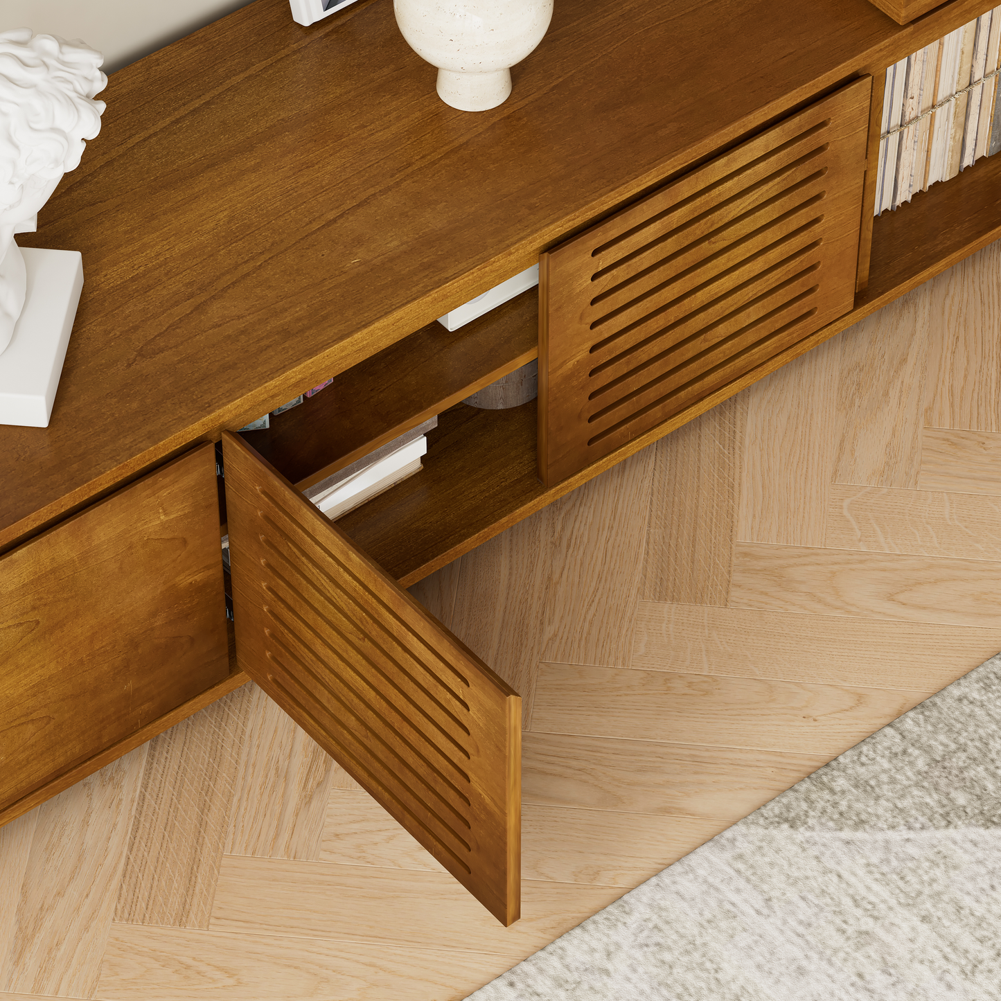 Walnut wood media console with slatted door ajar showcasing internal shelves