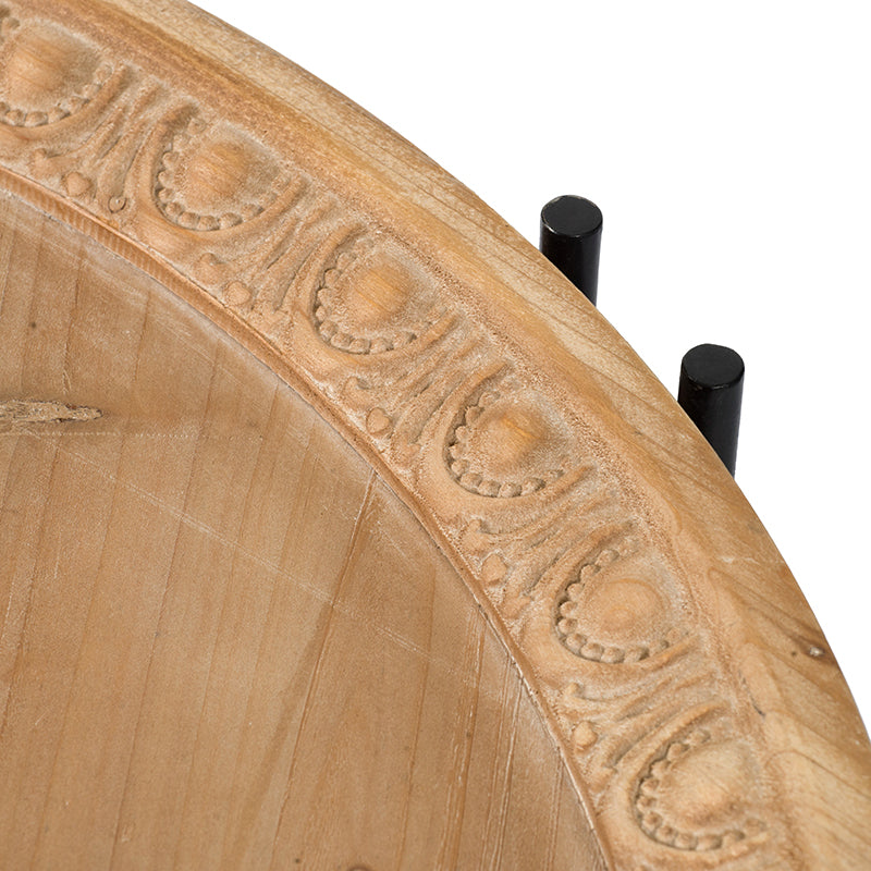 Light brown wooden tray with carved border and black metal accents