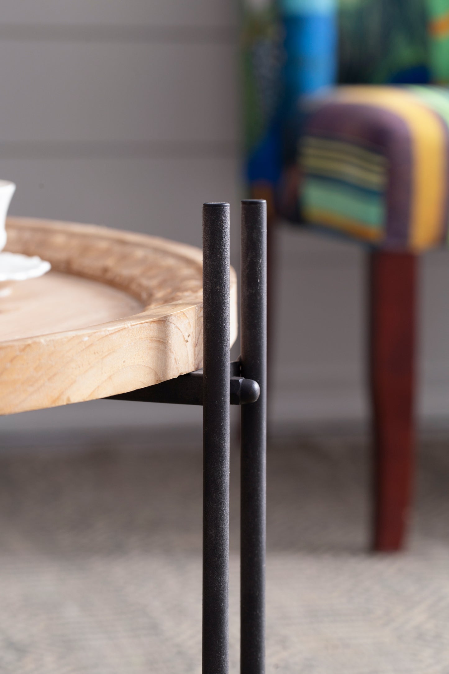 Round wood tray table with black metal legs perfect for living room decor