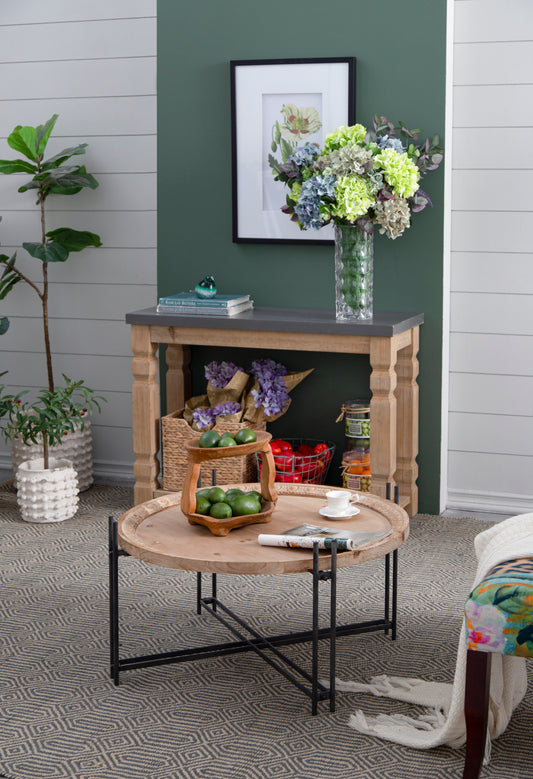 Wooden twotiered fruit basket with green limes perfect for kitchen countertop display