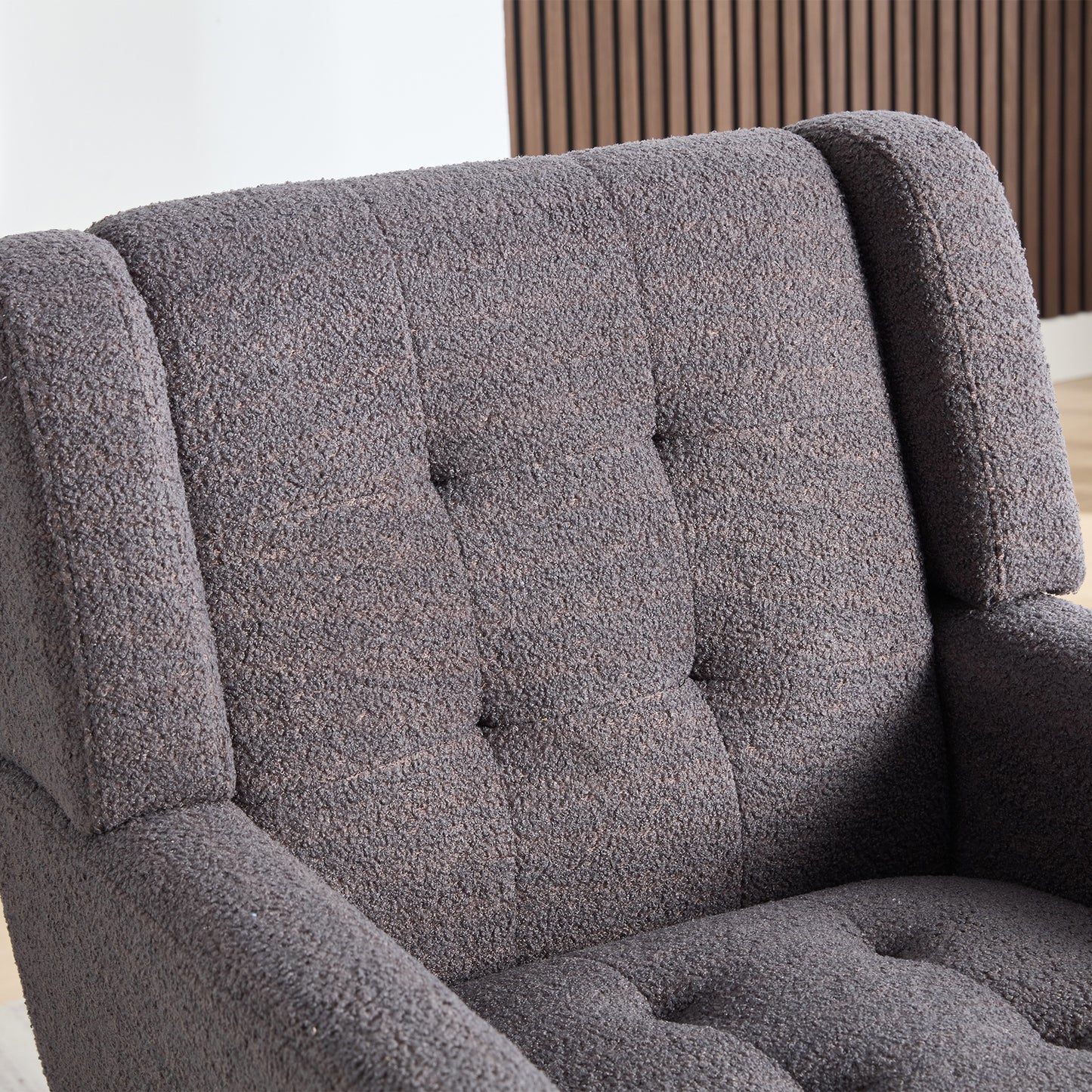 Textured charcoal grey armchair with button tufted back perfect for modern living rooms