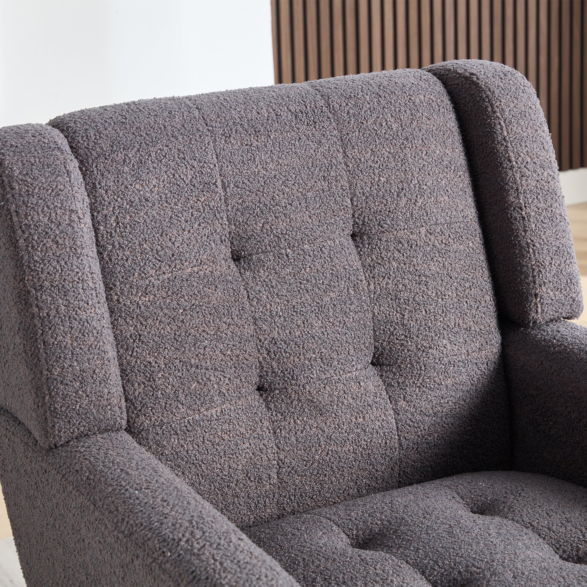 Textured charcoal grey armchair with button tufted back perfect for modern living rooms