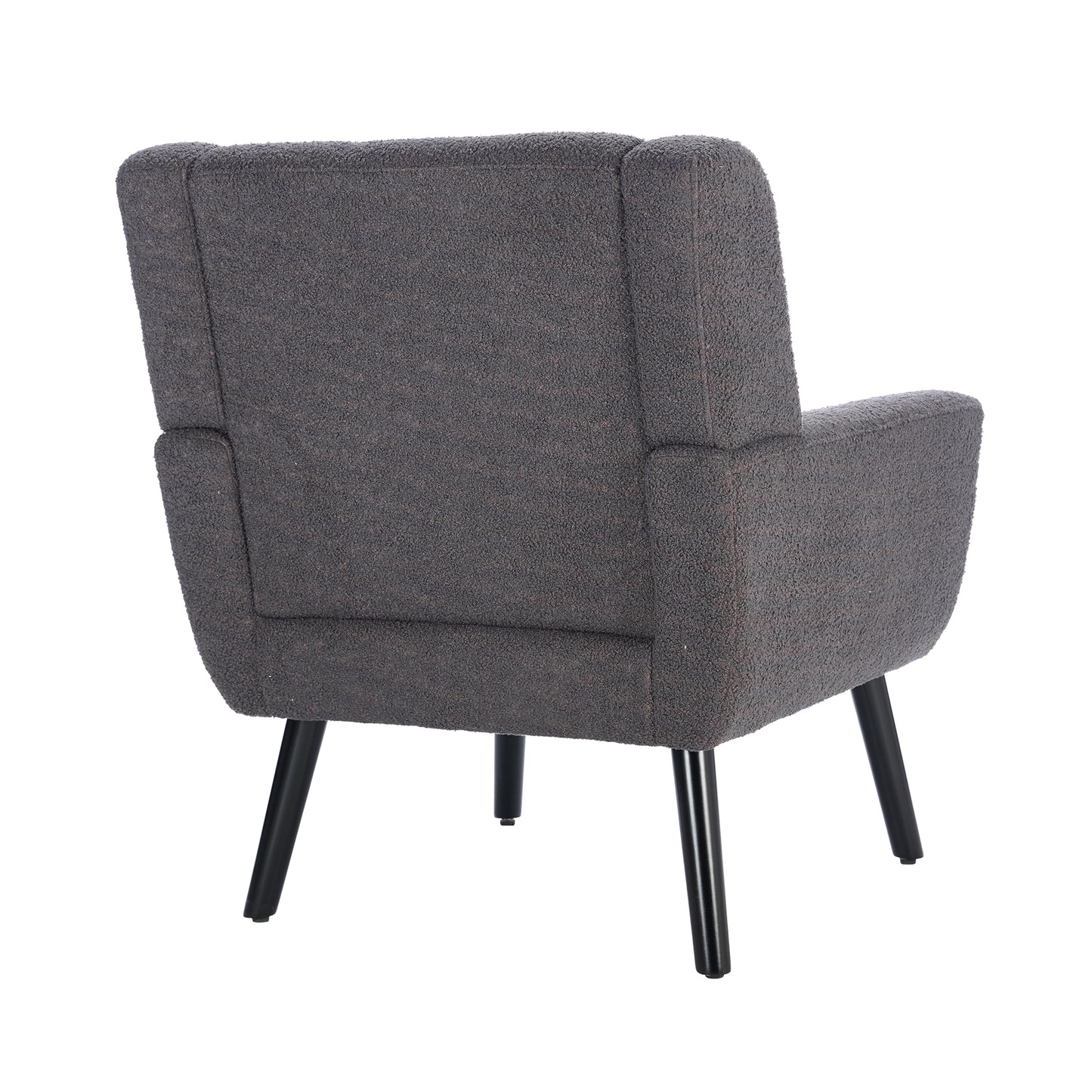 A dark grey textured armchair with tapered black legs perfect for a cozy reading nook
