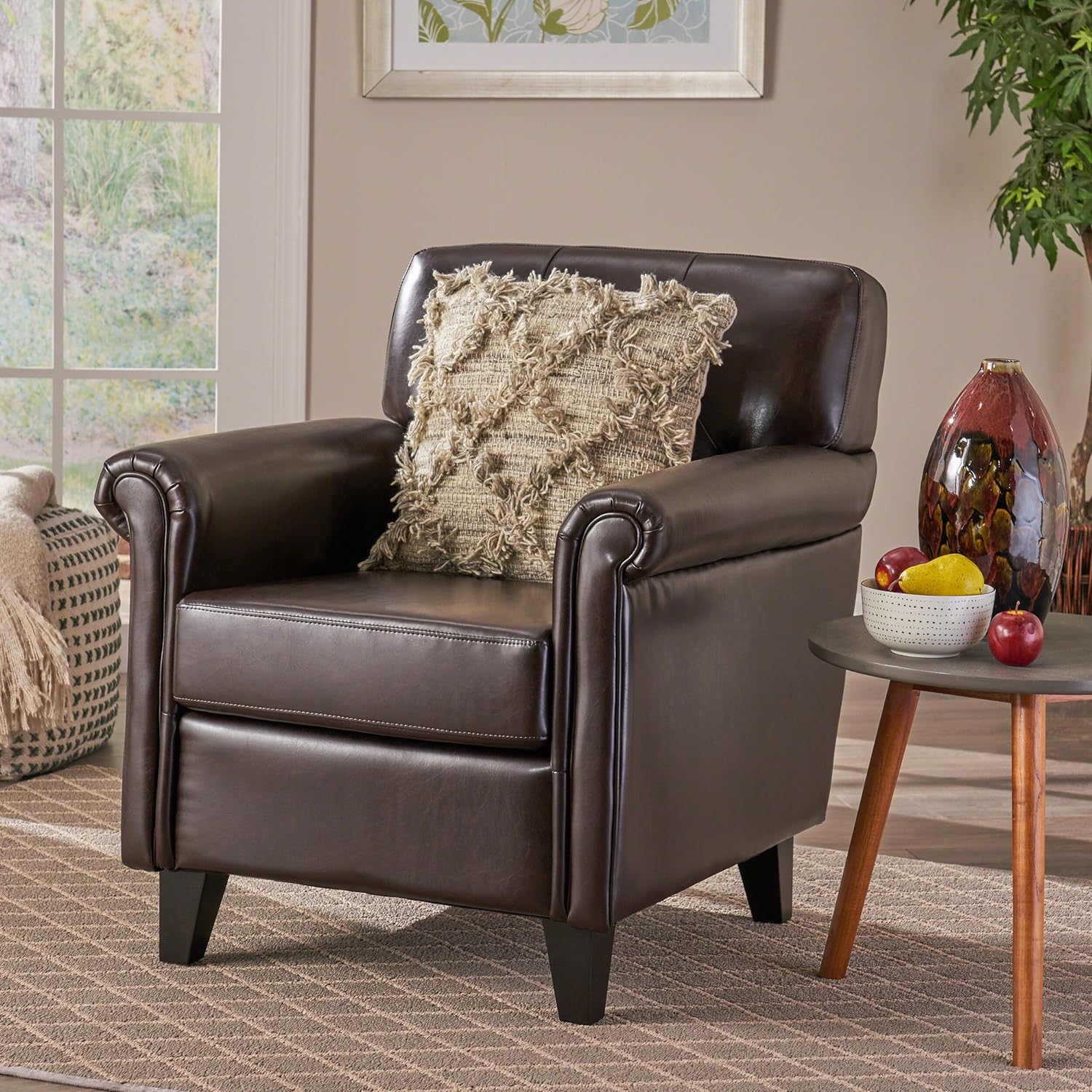 Dark brown leather accent chair with plush cushion and rolled arms