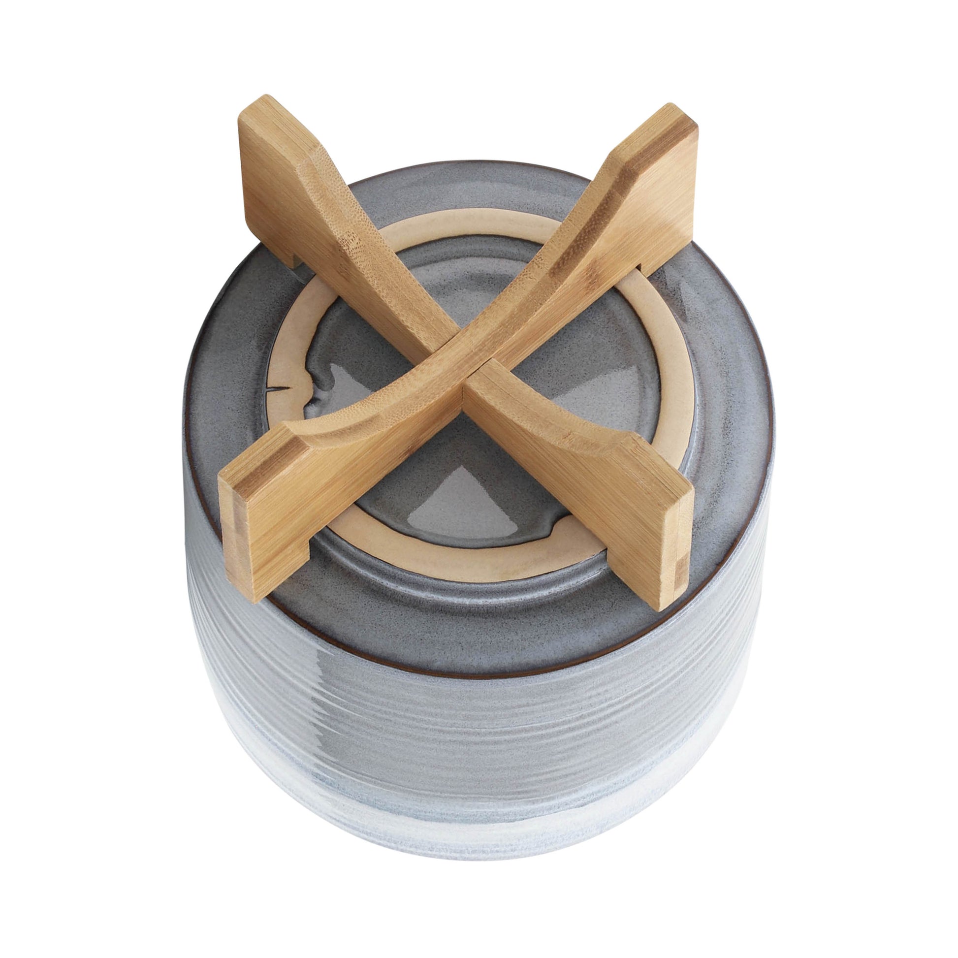 Stack of grey ceramic bowls with bamboo holder