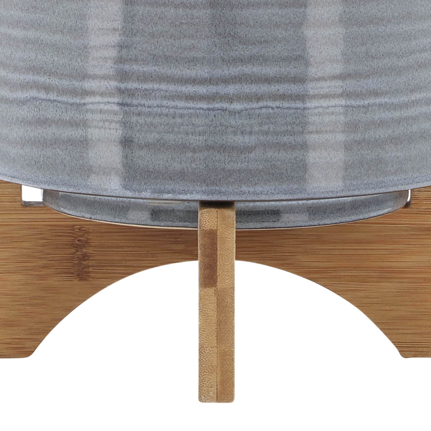 Gray ceramic planter with a textured finish on a bamboo stand