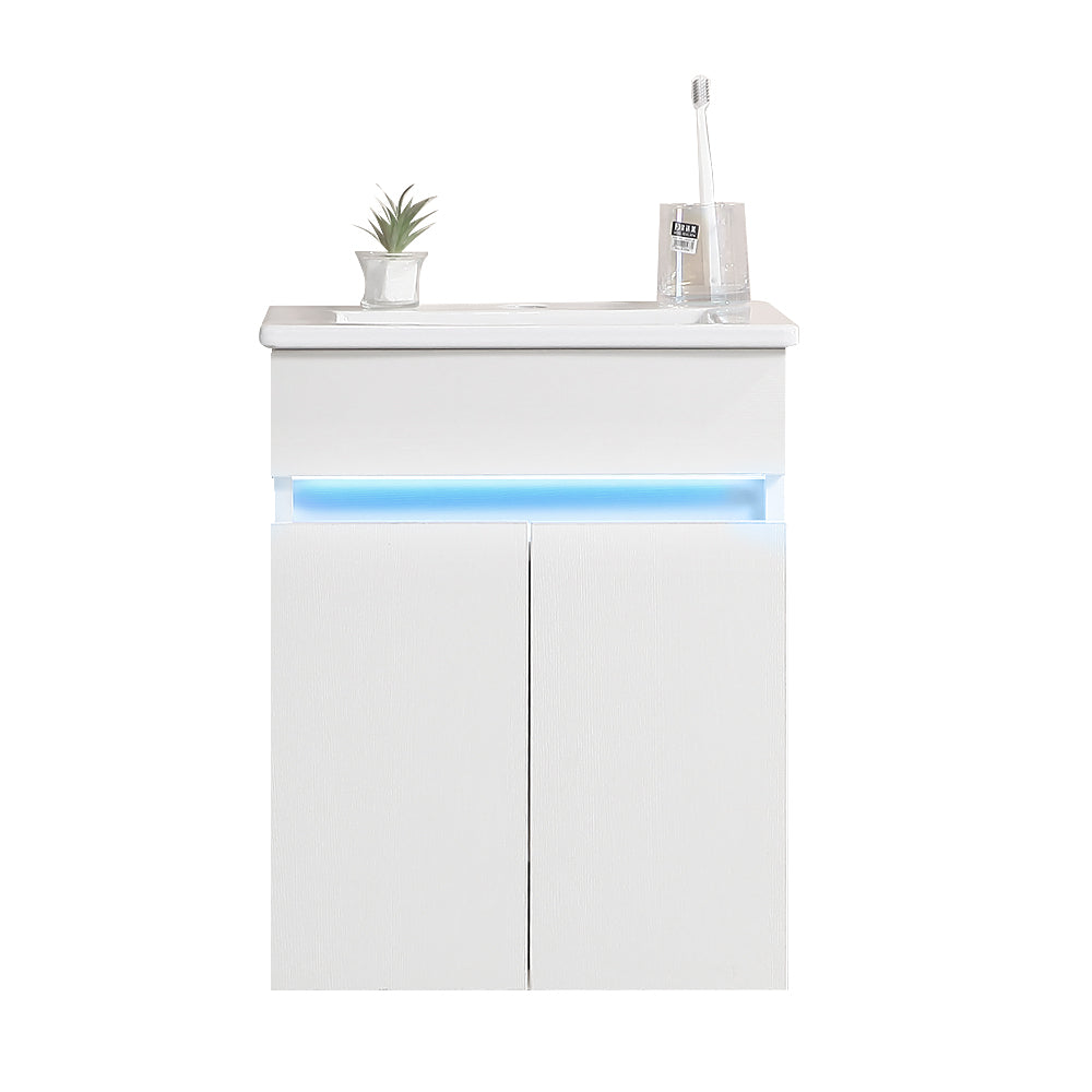 Modern white bathroom vanity cabinet with integrated blue LED lighting and two doors