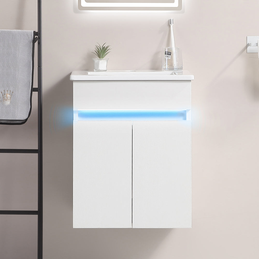 Modern white wallmounted bathroom vanity with LED accent lighting