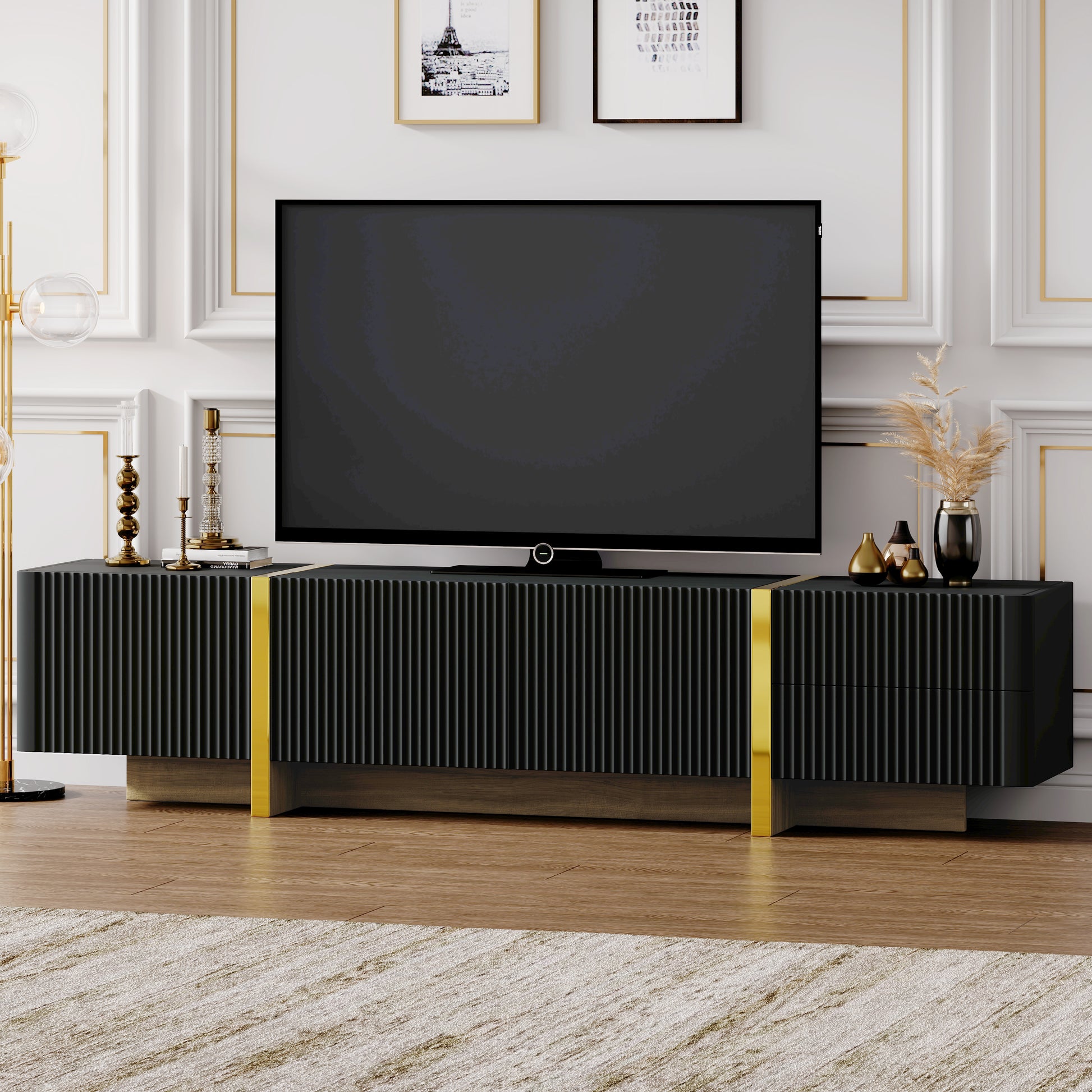 Sleek black media console with fluted doors and gold accents perfect for living room storage