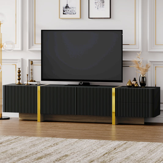 Sleek black media console with fluted doors and gold accents perfect for living room storage