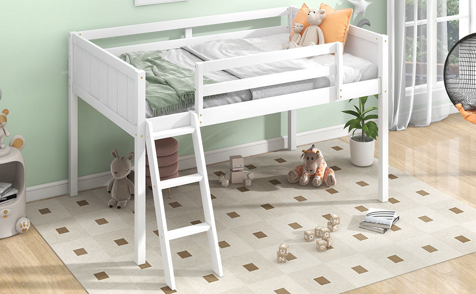 White wooden loft bed with green blanket and orange pillows