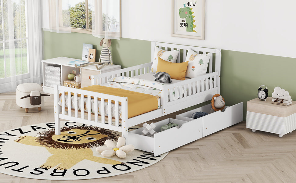White toddler bed with storage drawers and bedding
