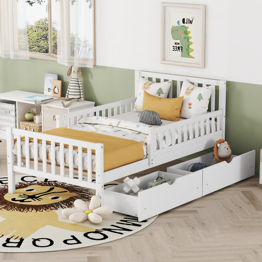 White wooden toddler bed with safety rails and storage drawers