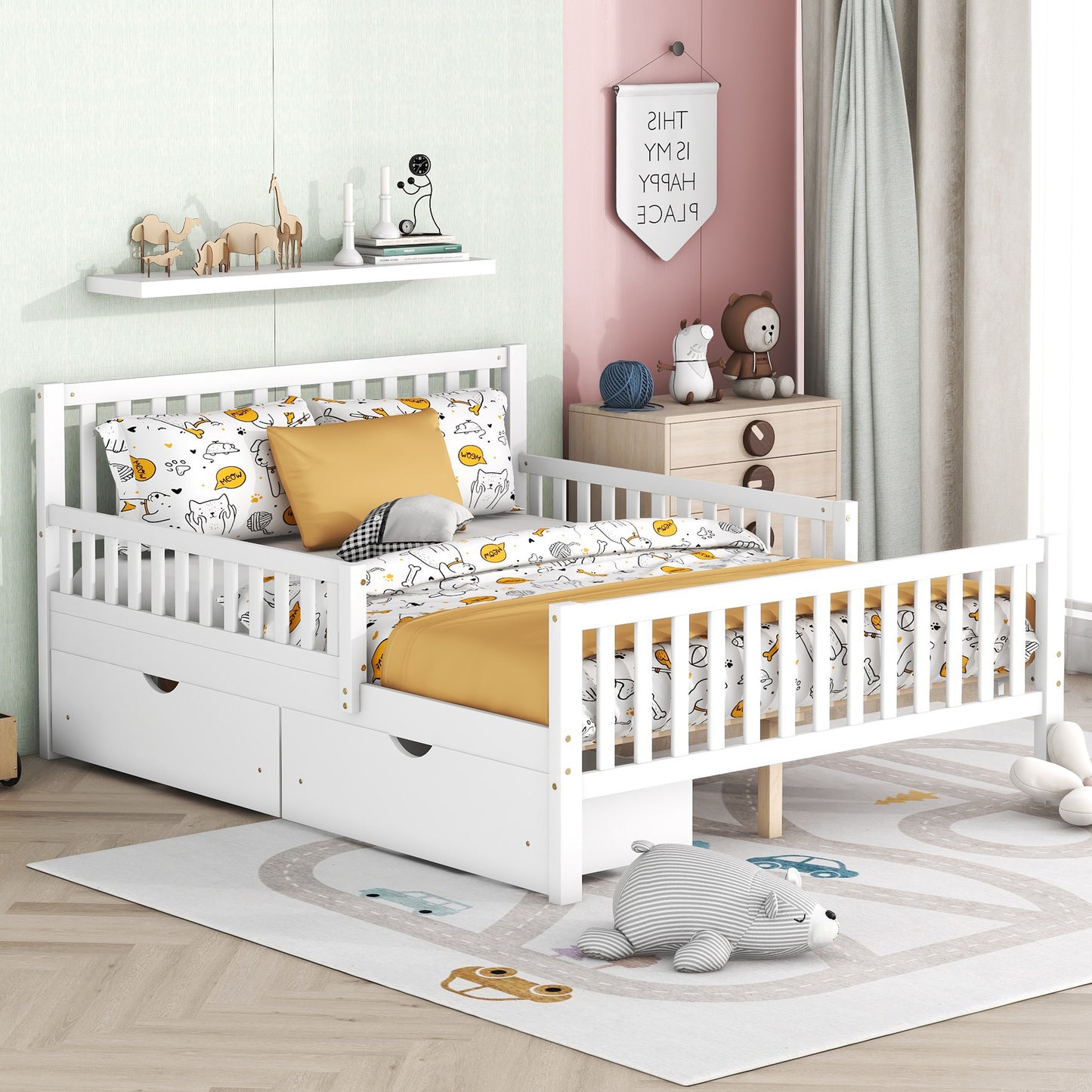 White wooden toddler bed with drawers and playful cat print bedding
