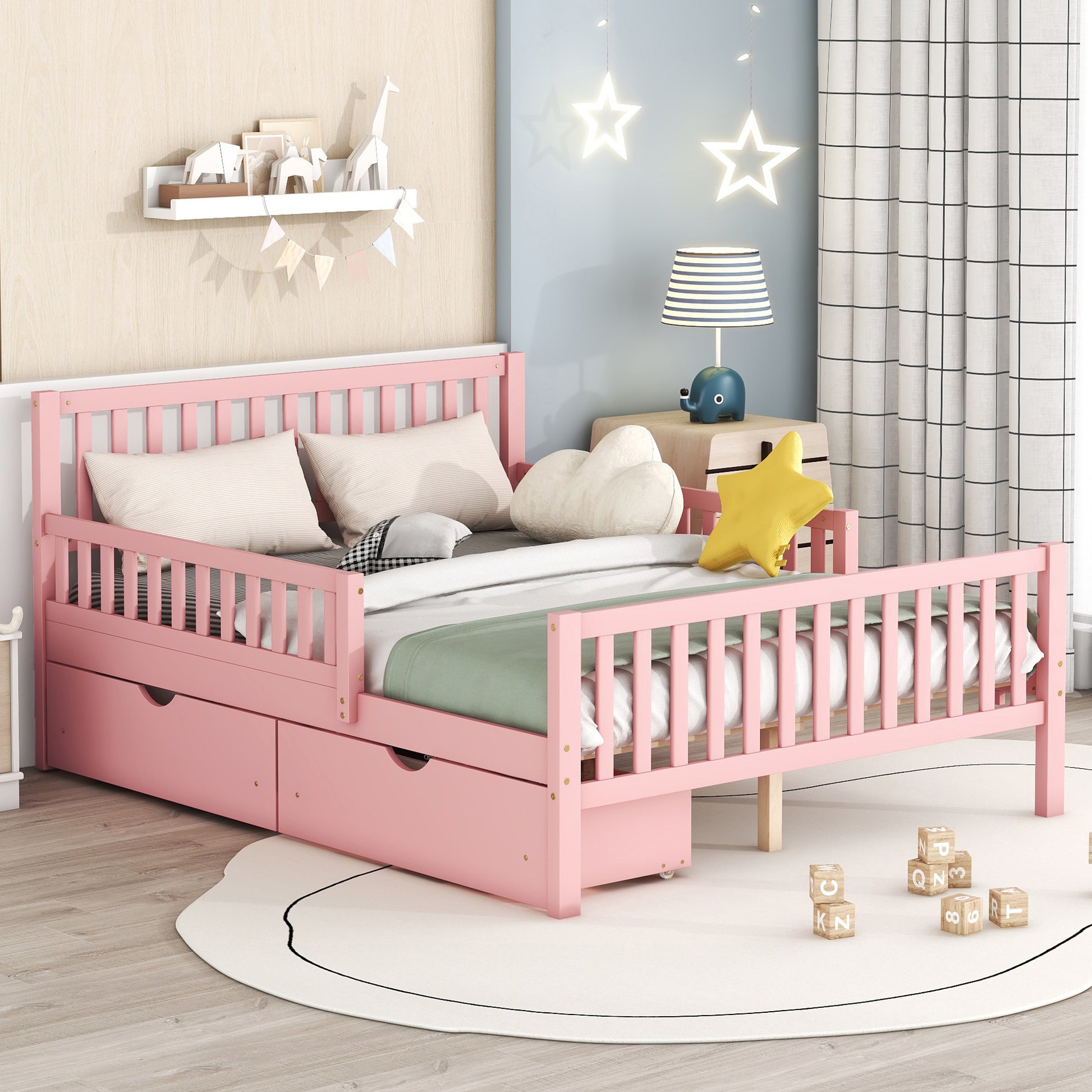 Pink toddler bed with safety rails and storage drawers