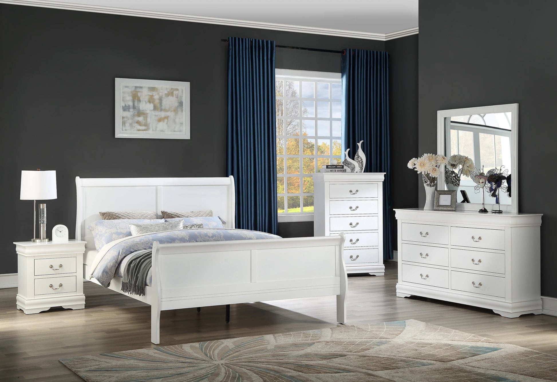 White sleigh bed with paneled headboard and footboard part of a bedroom set