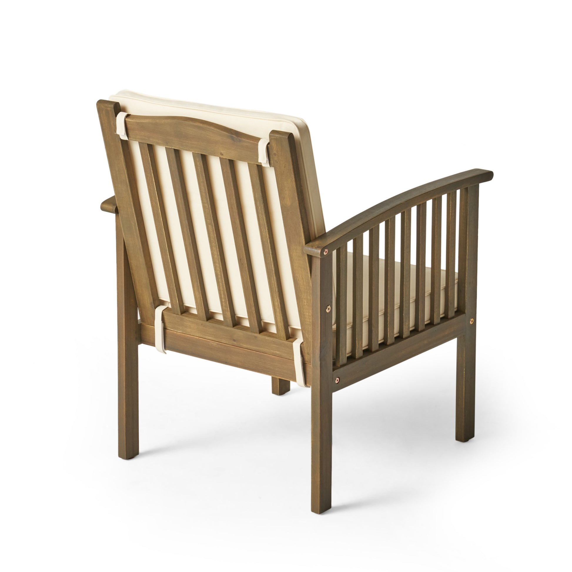 Dark brown wooden patio chair with cream cushions featuring slatted back and arms