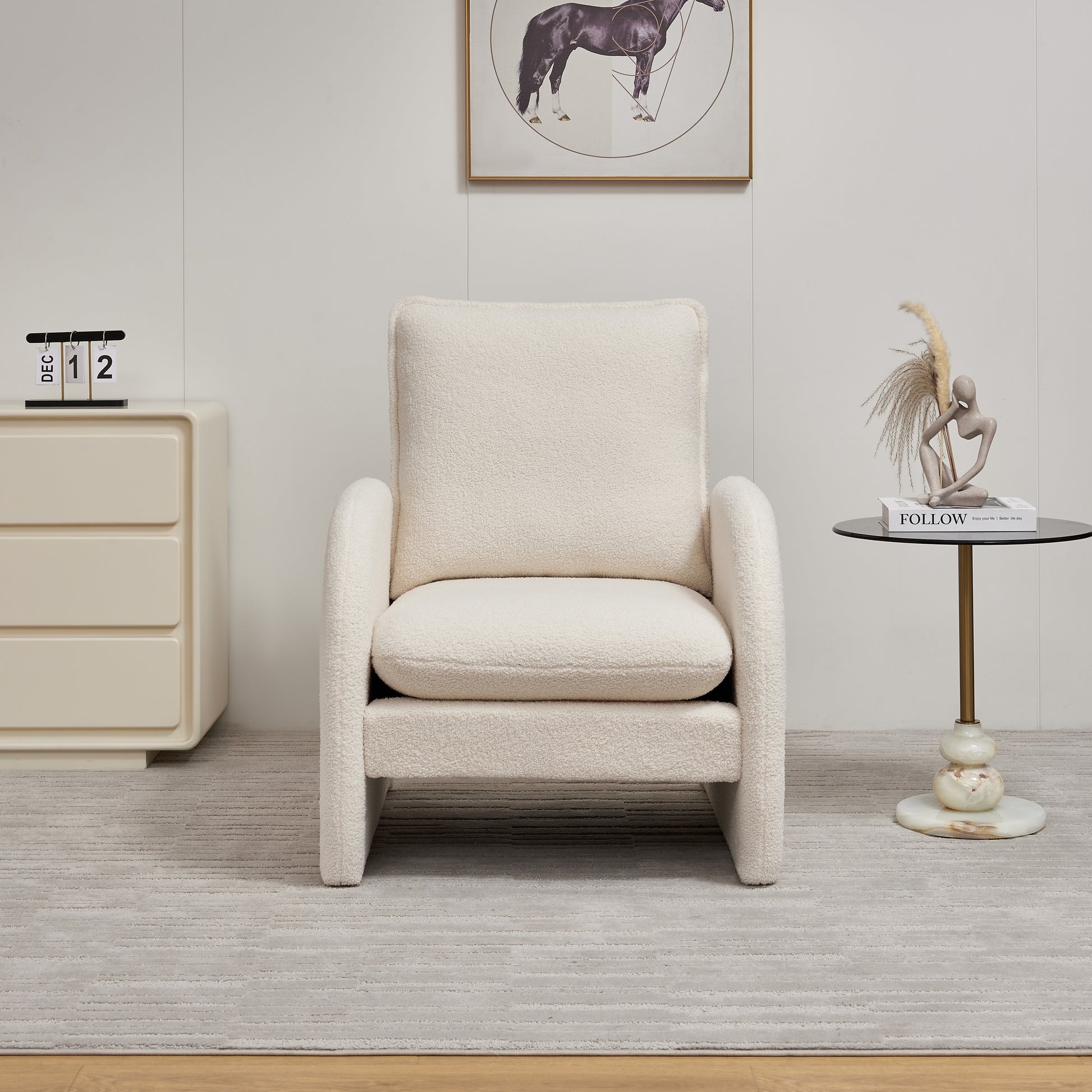 Plush cream boucle accent chair with a modern lowprofile design for living rooms