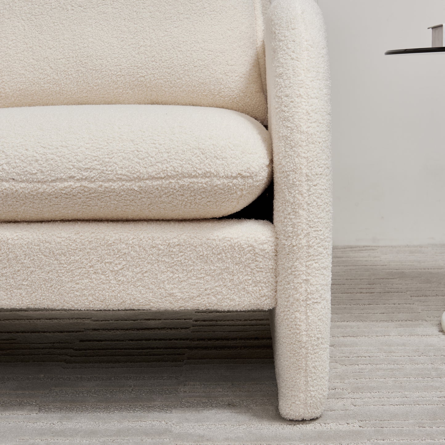 Plush cream boucle armchair with comfortable seat cushion perfect for cozy living rooms