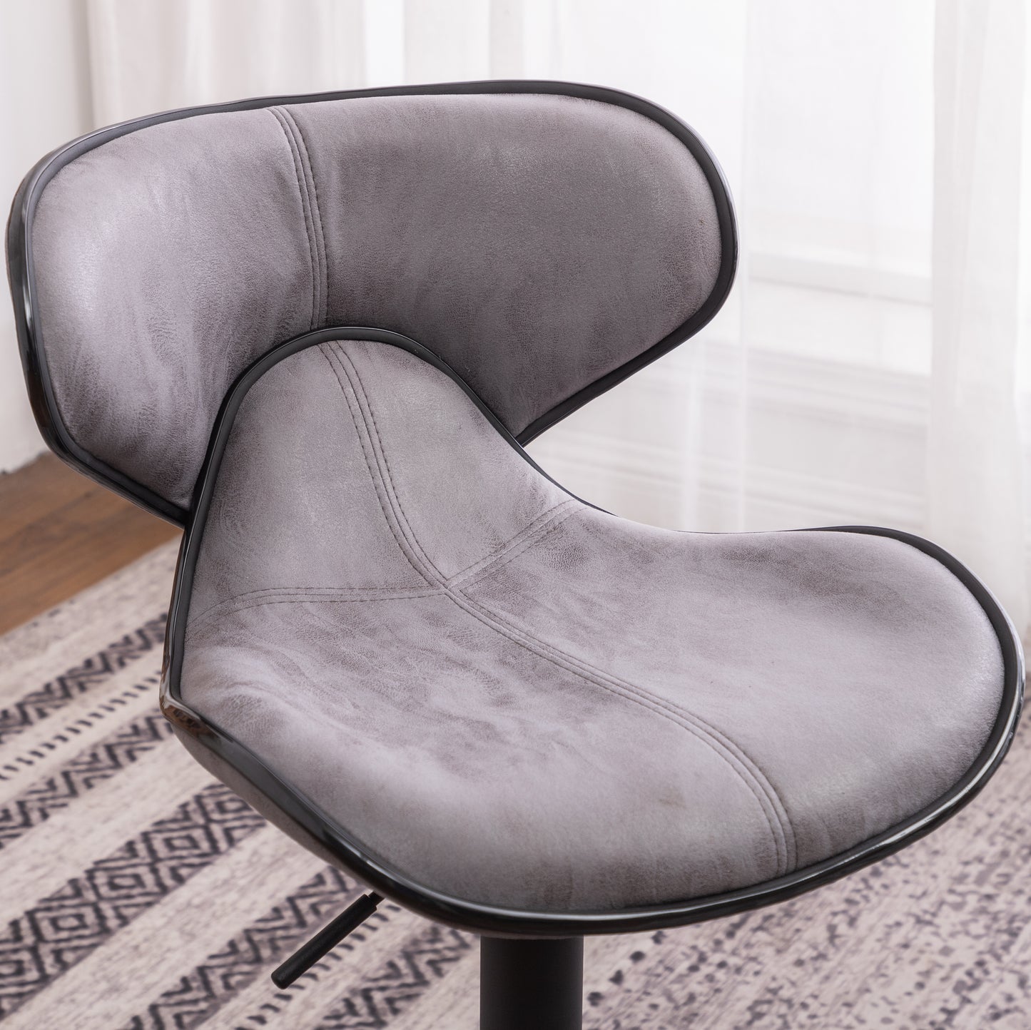 Grey faux leather bar stool with stitched detailing and black trim modern design