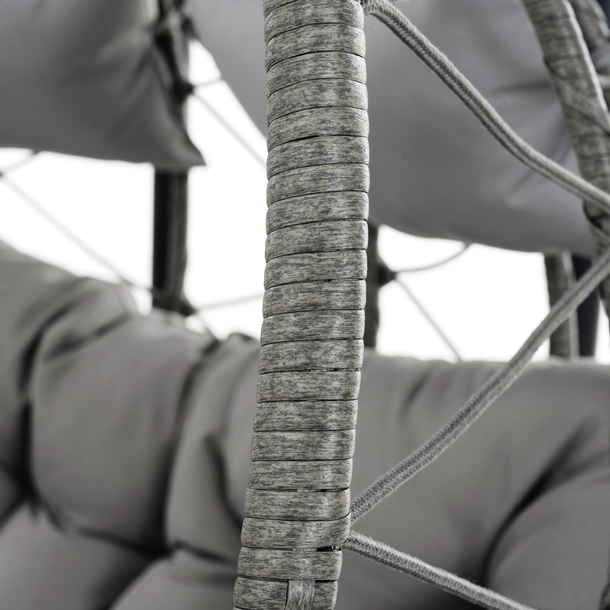 Close up of grey rattan weave on an outdoor chair showing texture