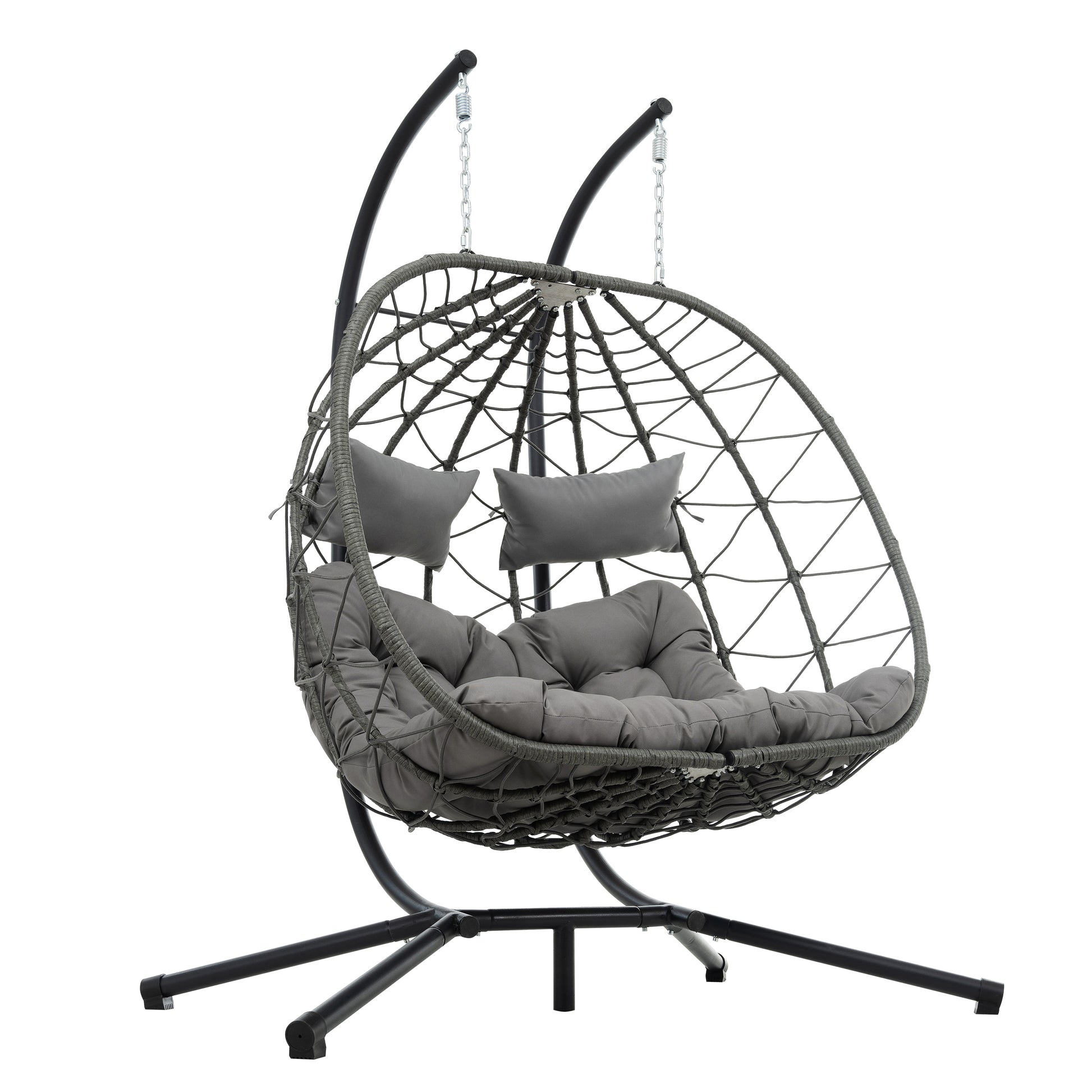 Grey wicker egg chair with comfortable cushions and a sturdy stand for outdoor relaxation