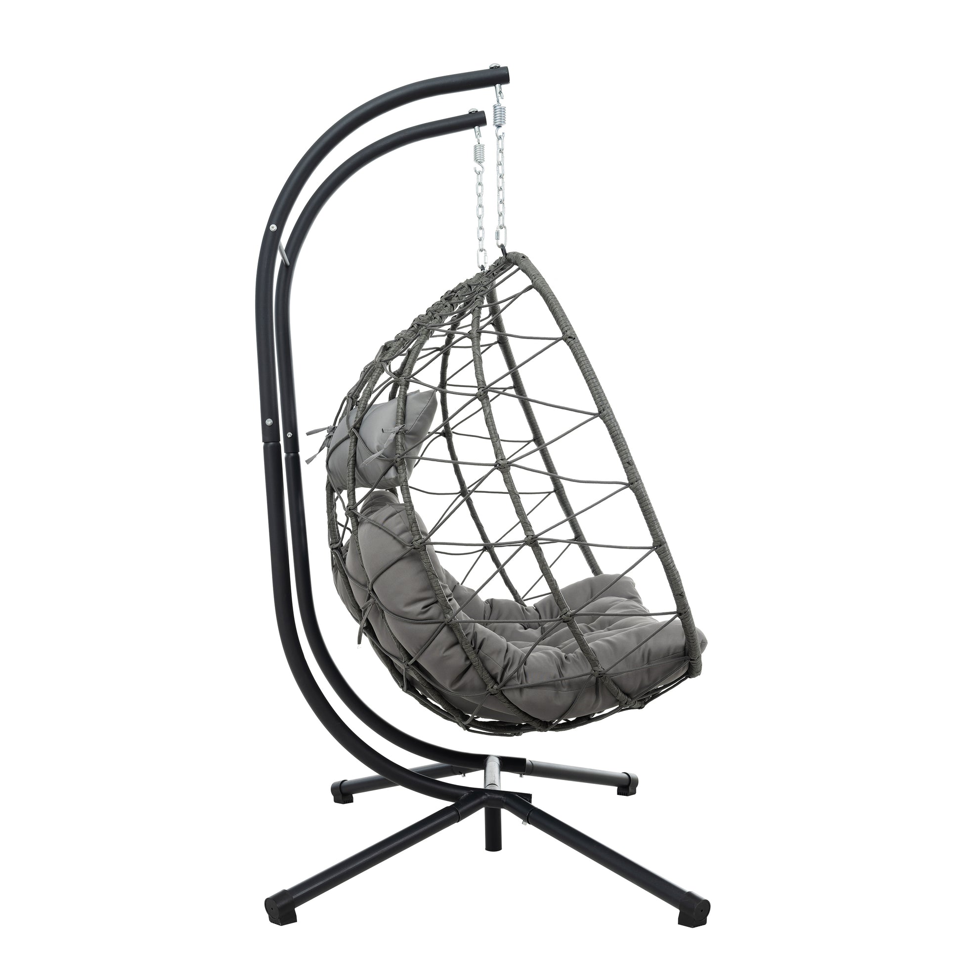 Gray wicker hanging egg chair with plush cushions and a black metal stand for ultimate relaxation