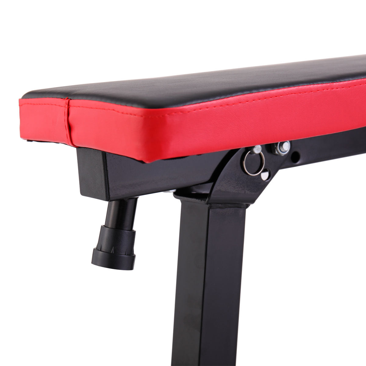 Black and red adjustable weight bench detail with padded seat
