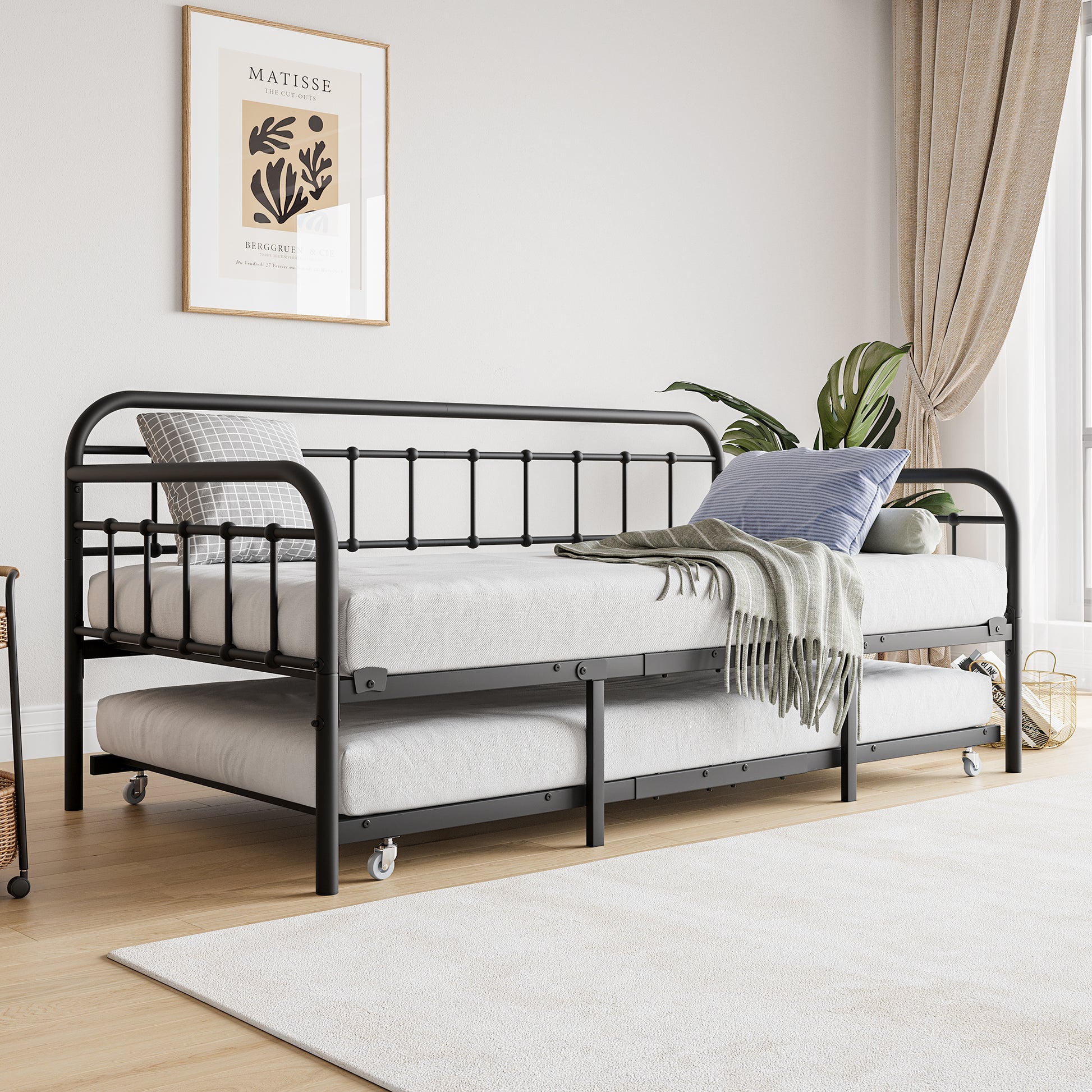 Black metal daybed with pullout trundle perfect for guest rooms or small spaces
