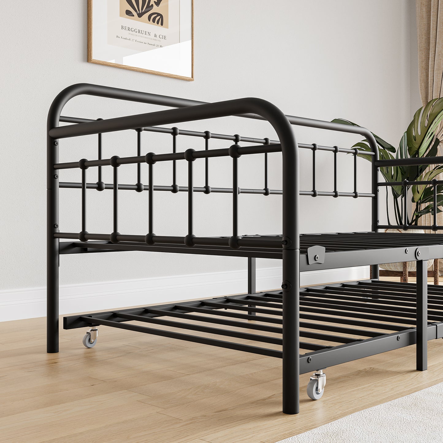 Black metal daybed frame with wheeled trundle perfect for small spaces and guest rooms