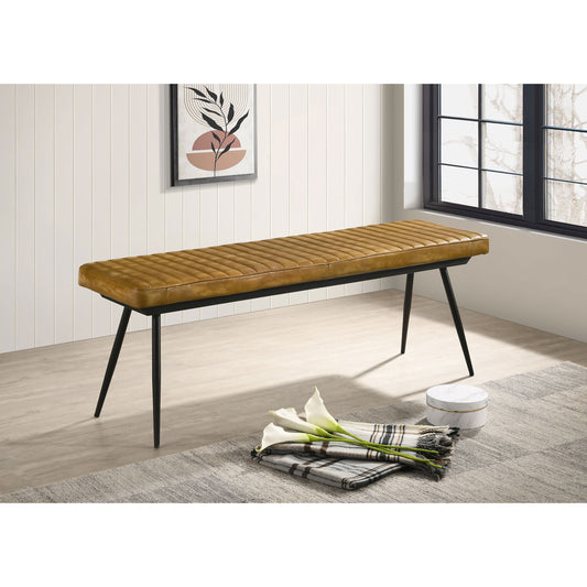Tan leather bench with quilted tufting and black metal legs