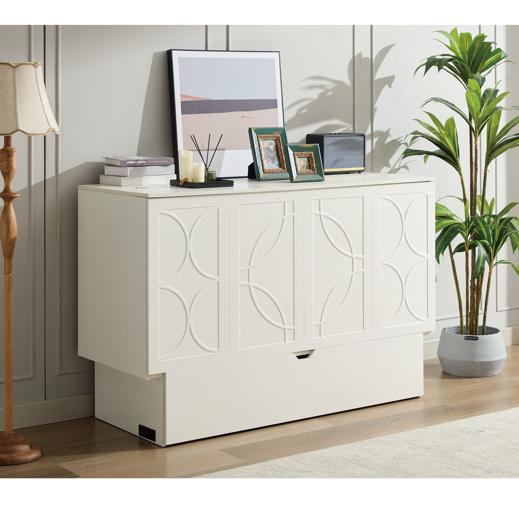 White cabinet with geometric carved doors and a pullout drawer
