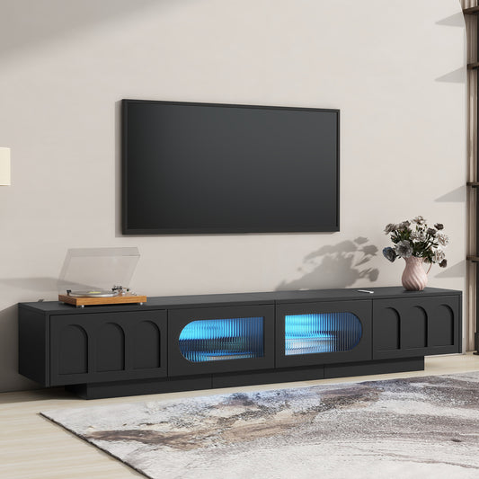 Modern black media console with textured glass doors and blue LED lighting
