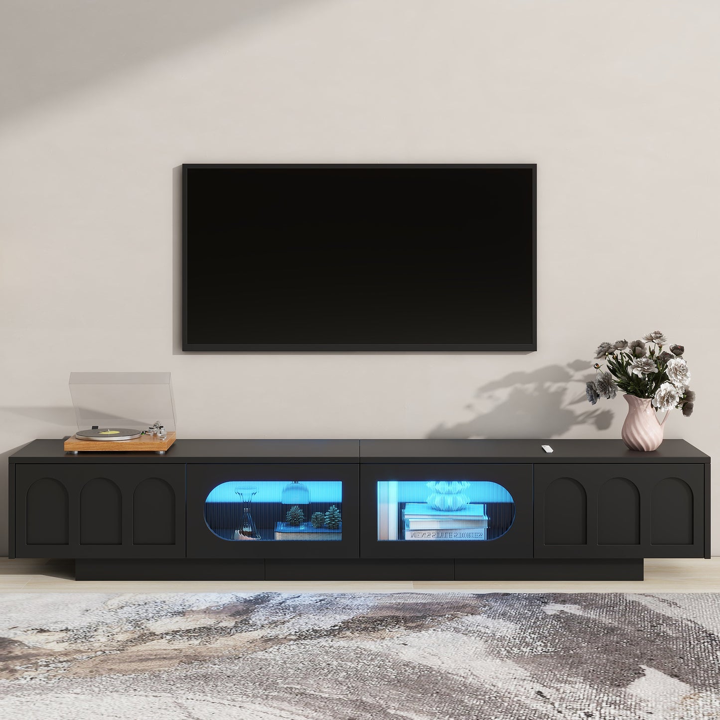 Black modern media console with arched cabinet doors and blue LED lighting