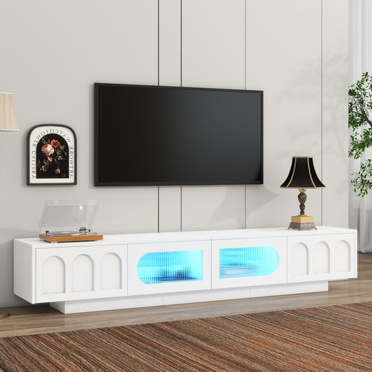 White modern entertainment center with arched doors and blue LED lighting