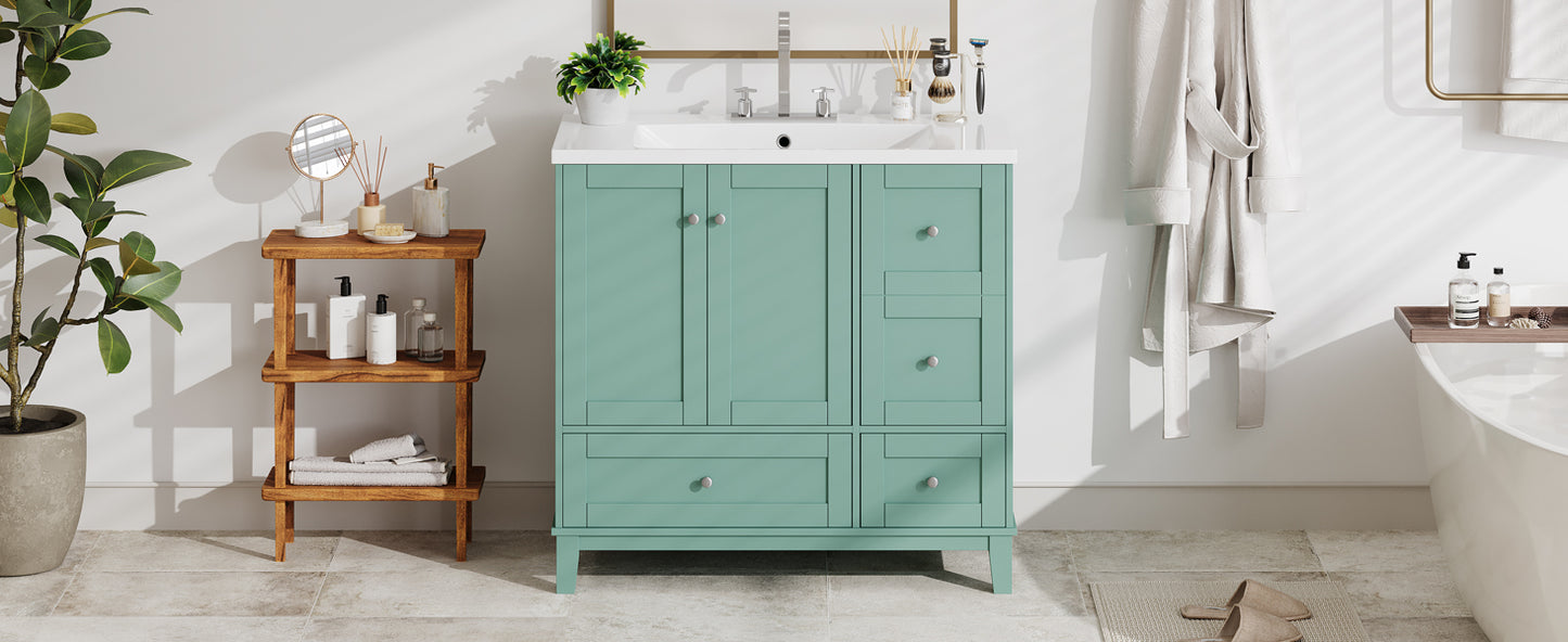 Teal bathroom vanity with white countertop and silver hardware featuring storage drawers and cabinets