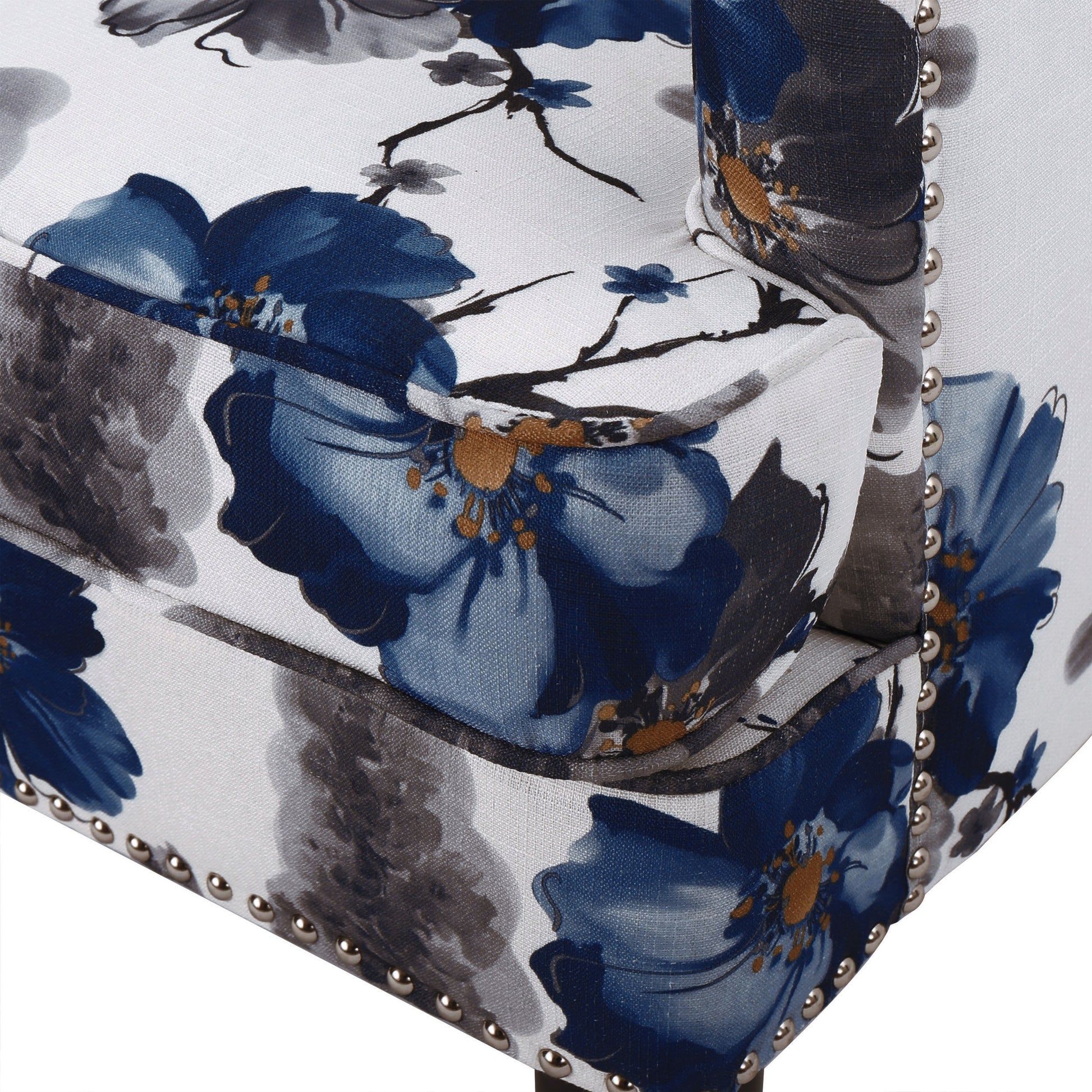 Armchair with blue floral print fabric silver stud trim detail