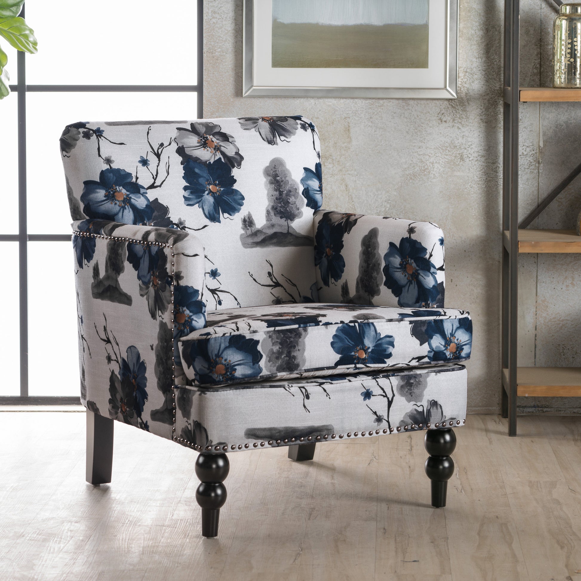 Transitional armchair with blue floral pattern upholstery and nailhead trim