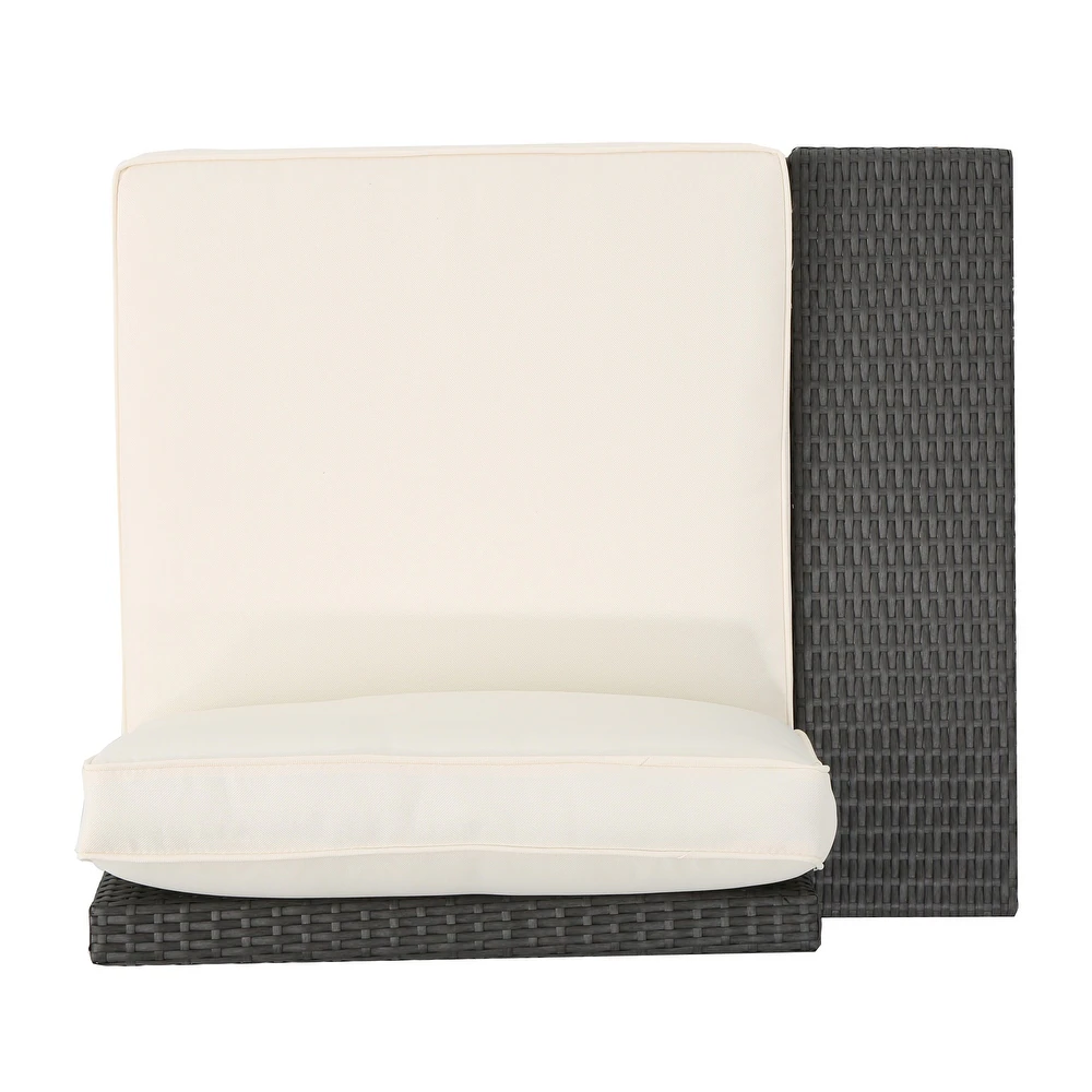 Top view of a plush cream cushion on a dark gray rattan outdoor chair perfect for patio seating