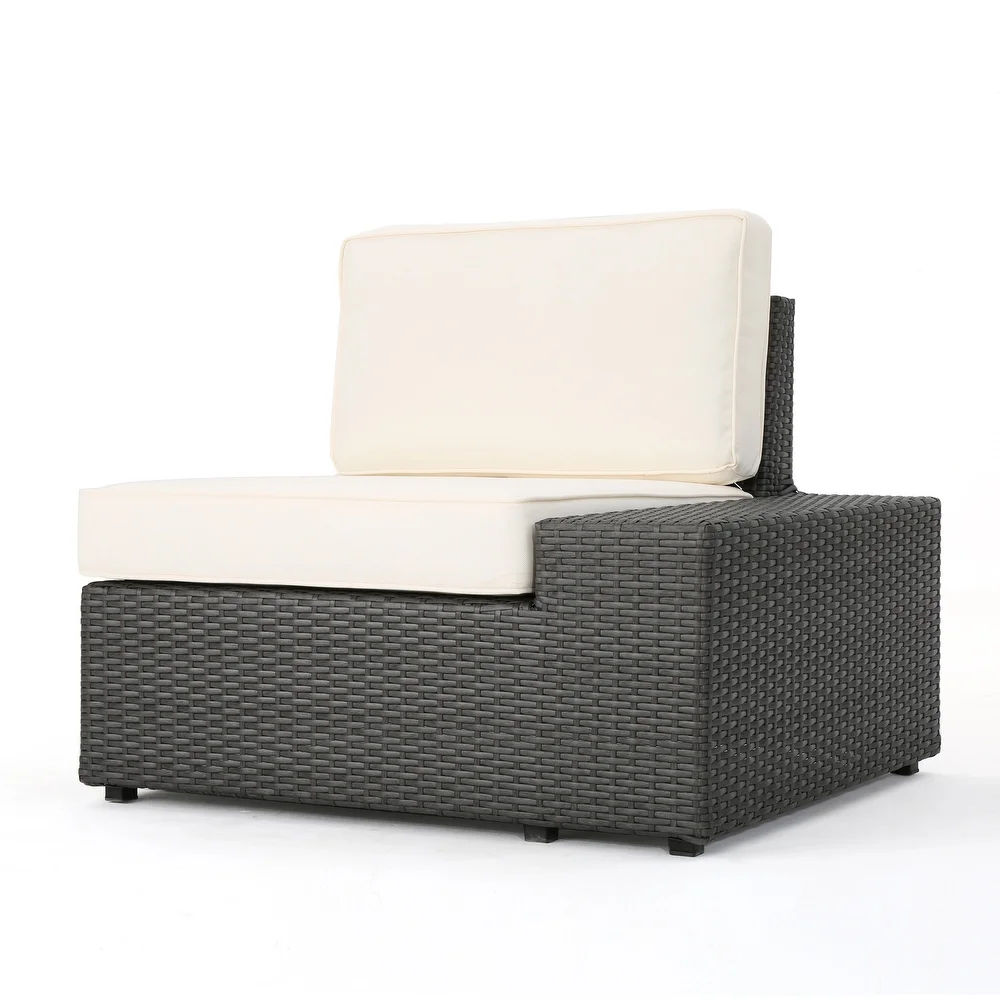 Dark grey wicker outdoor sectional armless chair with cream cushions