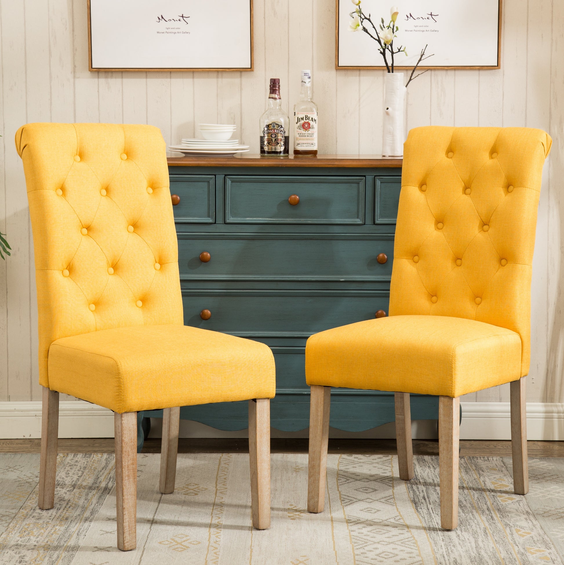 Tufted yellow dining chair with button accents and natural wood legs
