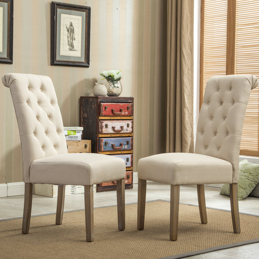 Two tufted linen dining chairs in natural beige with button accents and wooden legs
