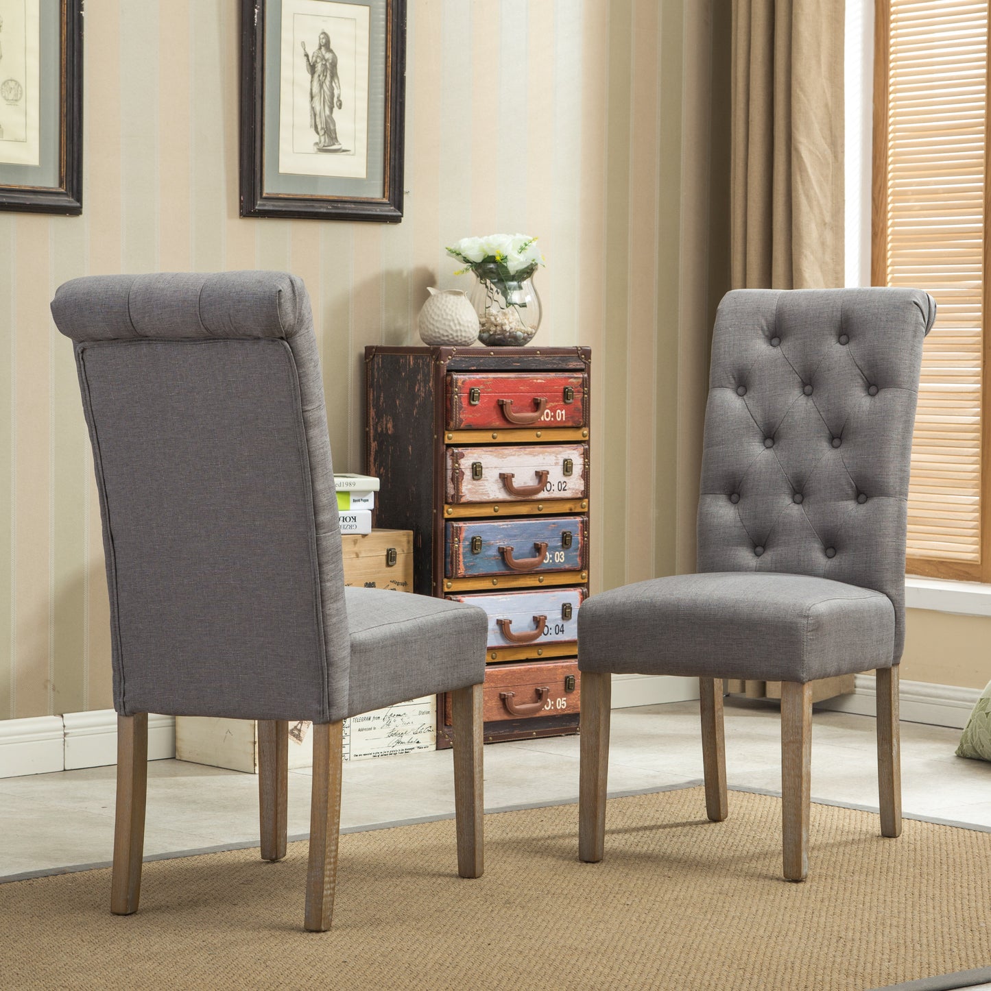 Tufted grey fabric dining chair with button accents and wooden legs
